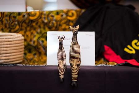 A pair of zebra sculptures sit perched on the silent auction table