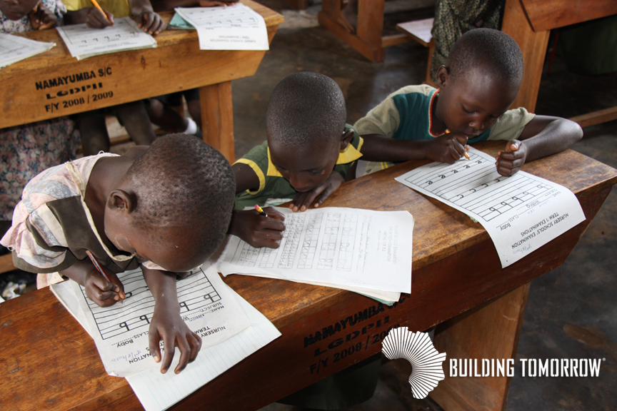 Students at the Building Tomorrow Academy of Buwasa, supported by Global Playground, sit for their first term examinations in August 2010.