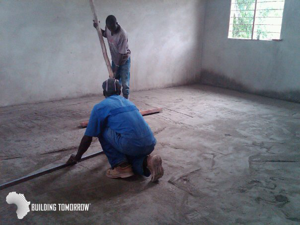 Finishing touches on the P6 classroom floor @ the BT Academy of Jomba!