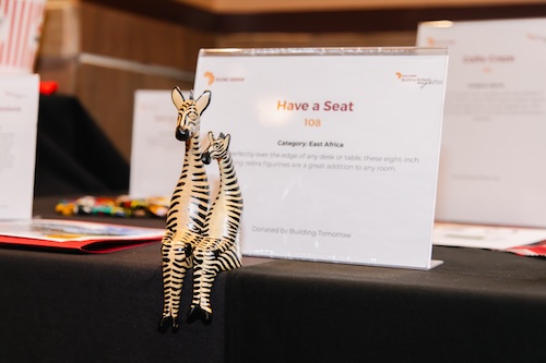 A pair of zebra sculptures sit perched on the silent auction table